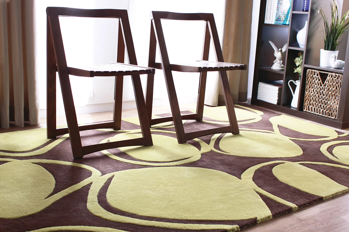 Chandra Inhabit INH-21604 Brown and Green rug, shown in a styled room setting