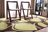 Chandra Inhabit INH-21604 Brown and Green rug, shown in a styled room setting