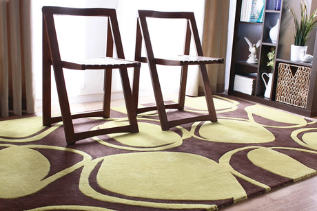 Chandra Inhabit INH-21604 Brown and Green rug, shown in a styled room setting