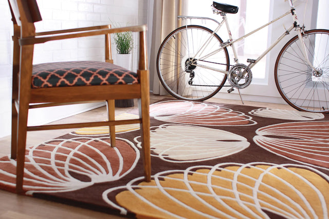 Chandra Inhabit INH-21606 Brown and Orange and White and Peach rug, shown in a styled room setting