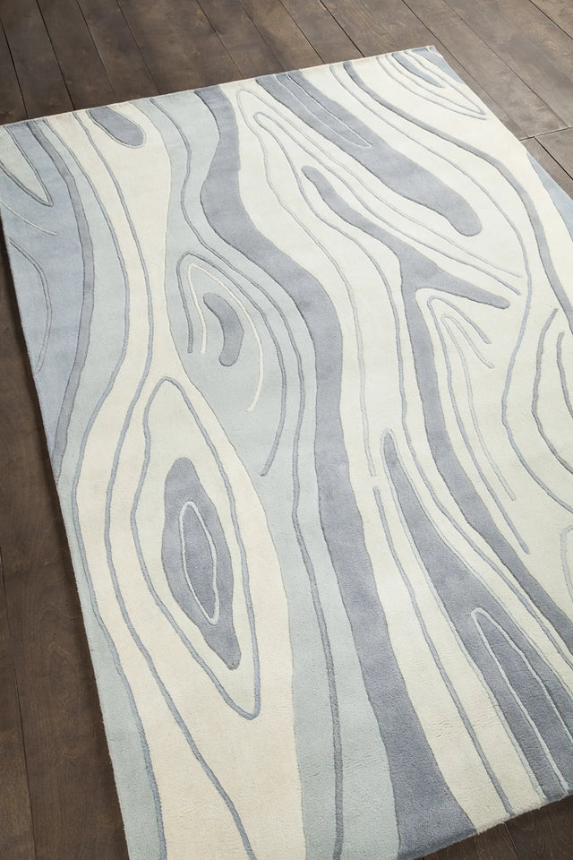 Chandra Inhabit INH-21615 Blue and Grey and White rug, angled side view