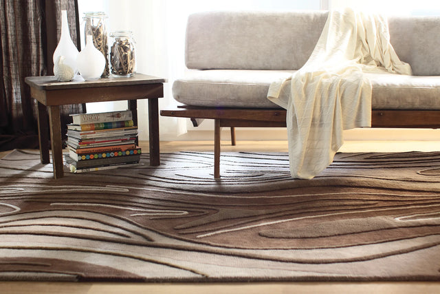 Chandra Inhabit INH-21616 Brown rug, shown in a styled room setting