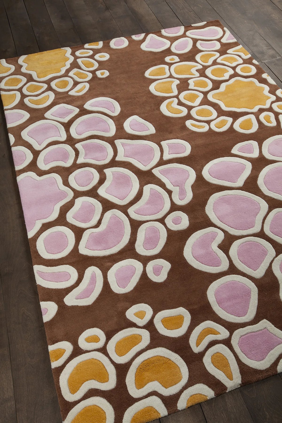 Chandra Inhabit INH-21627 Brown and Orange and Pink and White rug, angled side view
