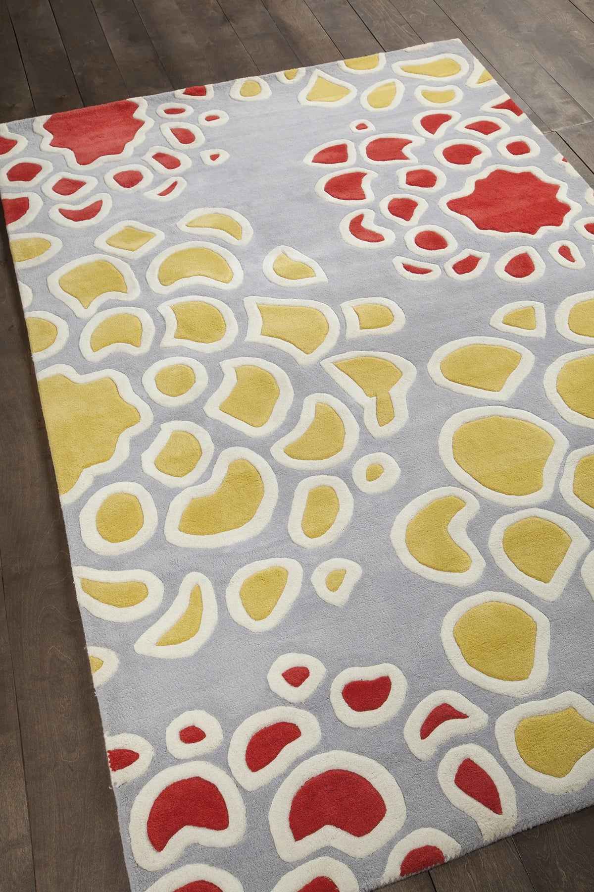 Chandra Inhabit INH-21628 Grey and Gold and Red and White rug, angled side view