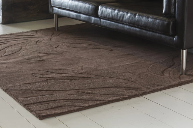 Chandra Jaipur JAI-18904 Brown rug, shown in a styled room setting