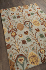 Chandra Rupec RUP-39608 Blue and Brown and Gold and Grey and Green rug, angled side view