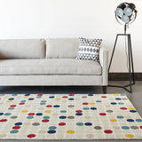 Chandra Stella STE-52219 Cream and Beige and Red and Yellow and Blue rug, shown in a room setting