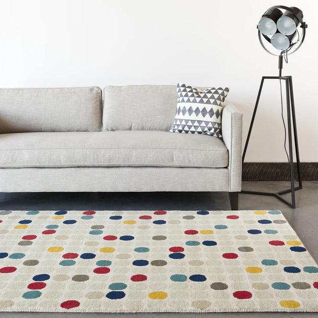Chandra Stella STE-52219 Cream and Beige and Red and Yellow and Blue rug, shown in a room setting