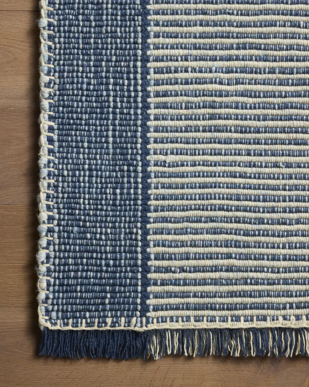 Loloi Sigrid SIG-03 Indigo / Ivory Rug - corner on wood