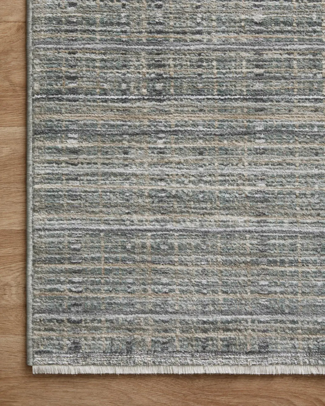 Loloi Soho Soh-04 Jade/Stone Rug - corner on wood