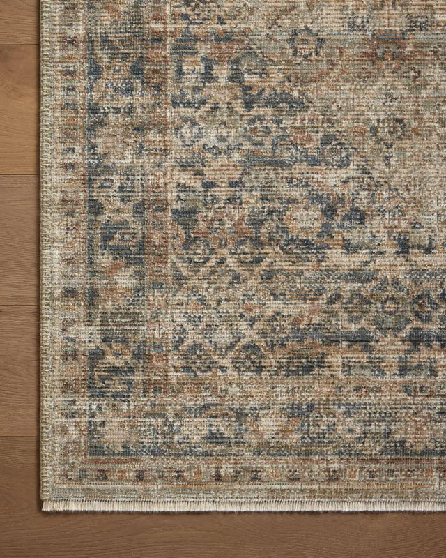 Loloi Heritage Her-08 Sage/Navy Rug - corner on wood