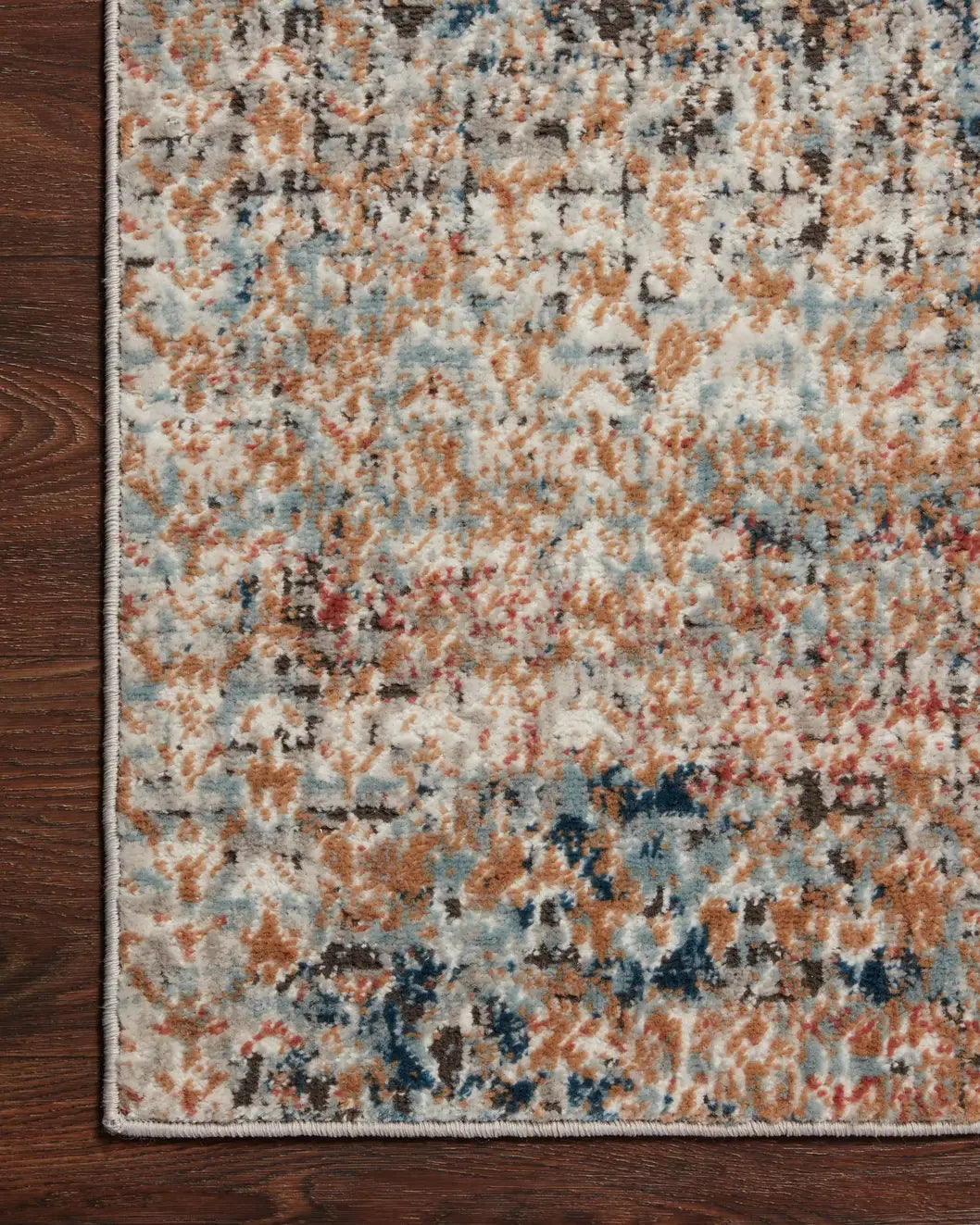 Loloi Bianca Bia-09 Ocean/Spice Rugs - corner on wood