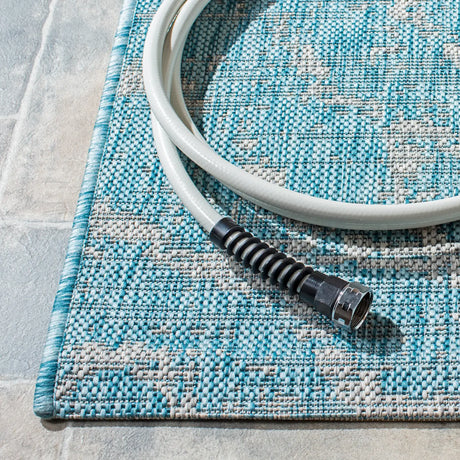 Safavieh Courtyard 4'-5" x 6'-5" Rug in Aqua / Grey