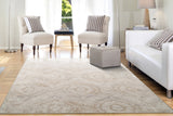 Beige abstract transitional area rug with distressed swirls, rectangular