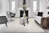 Power loomed modern rectangular rug in ivory and beige