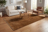 Rust-brown rectangular traditional area rug with subtle border and dense pile