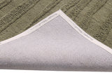 Handmade modern green rug, textured loop pile with visible stitched edge binding