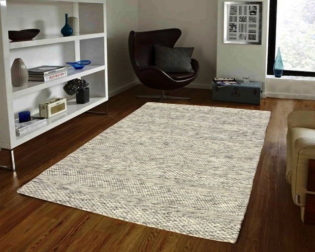Light grey modern rectangular area rug with textured woven surface