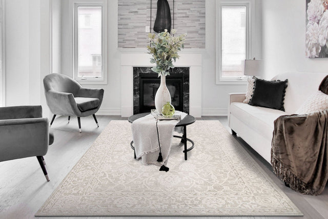 Rectangular cream traditional power loomed rug with ornate border and center pattern