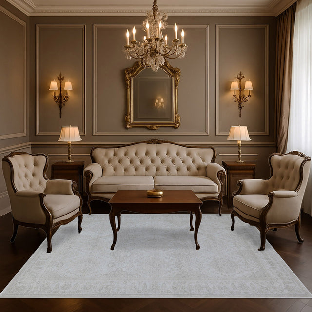 Ivory and grey traditional area rug with subtle pattern, full view.