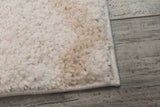 Ivory and beige power-loomed modern area rug, plush short-pile close-up corner