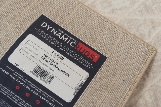 Modern grey power loomed rug, close-up texture with cream-beige flecks