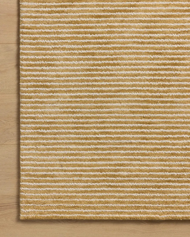 Loloi Sunday SUN-01 Wheat / Ivory Hand Tufted Rug - corner on wood