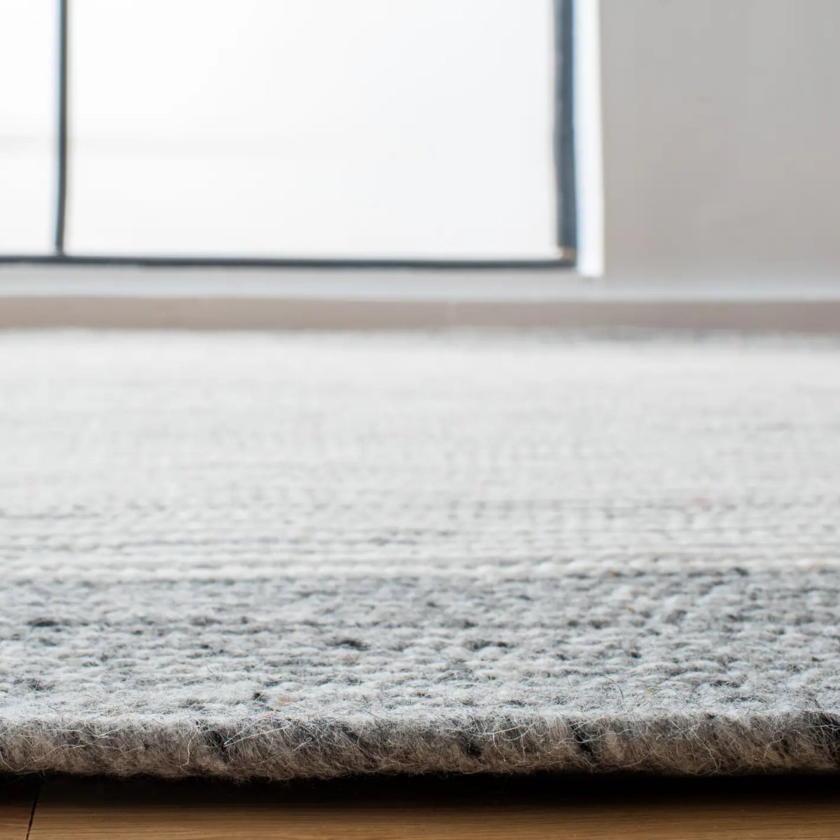 Safavieh Braided 5'-0" x 7'-0" Rug in Grey / Ivory