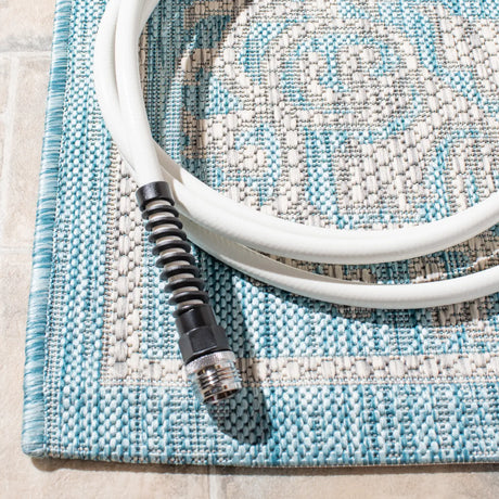 Safavieh Courtyard 5'-3" x 7'-7" Rug in Aqua / Grey