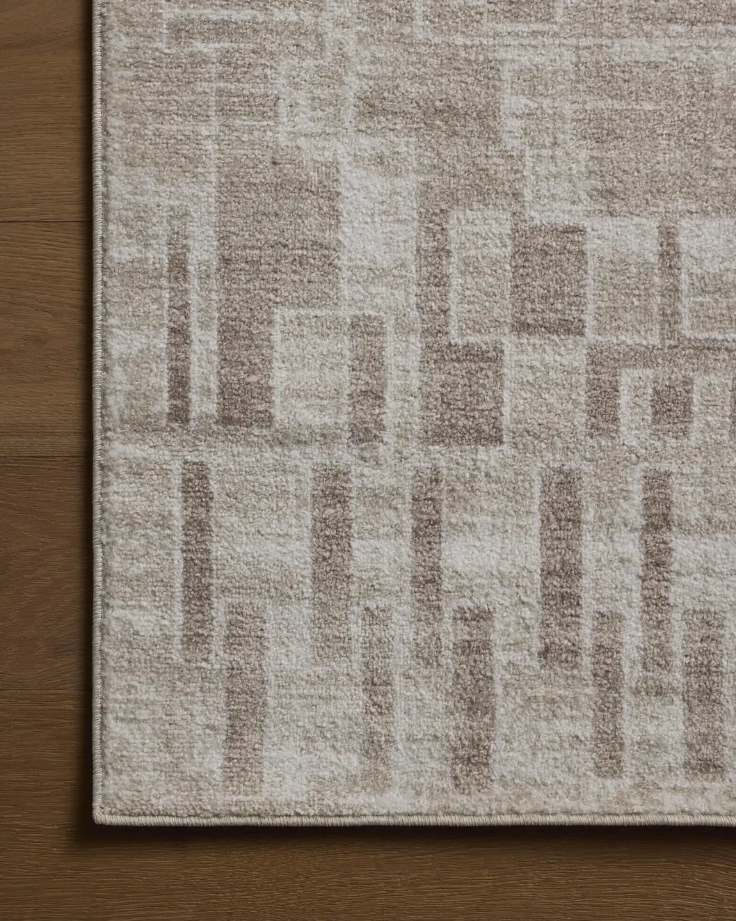 Loloi Lune LUN-02 Ivory / Mushroom Rug - corner on wood
