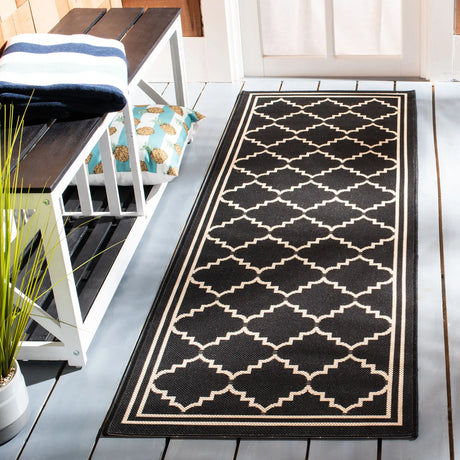 Safavieh Courtyard 2'-3" x 10'-0" Rug in Black / Creme