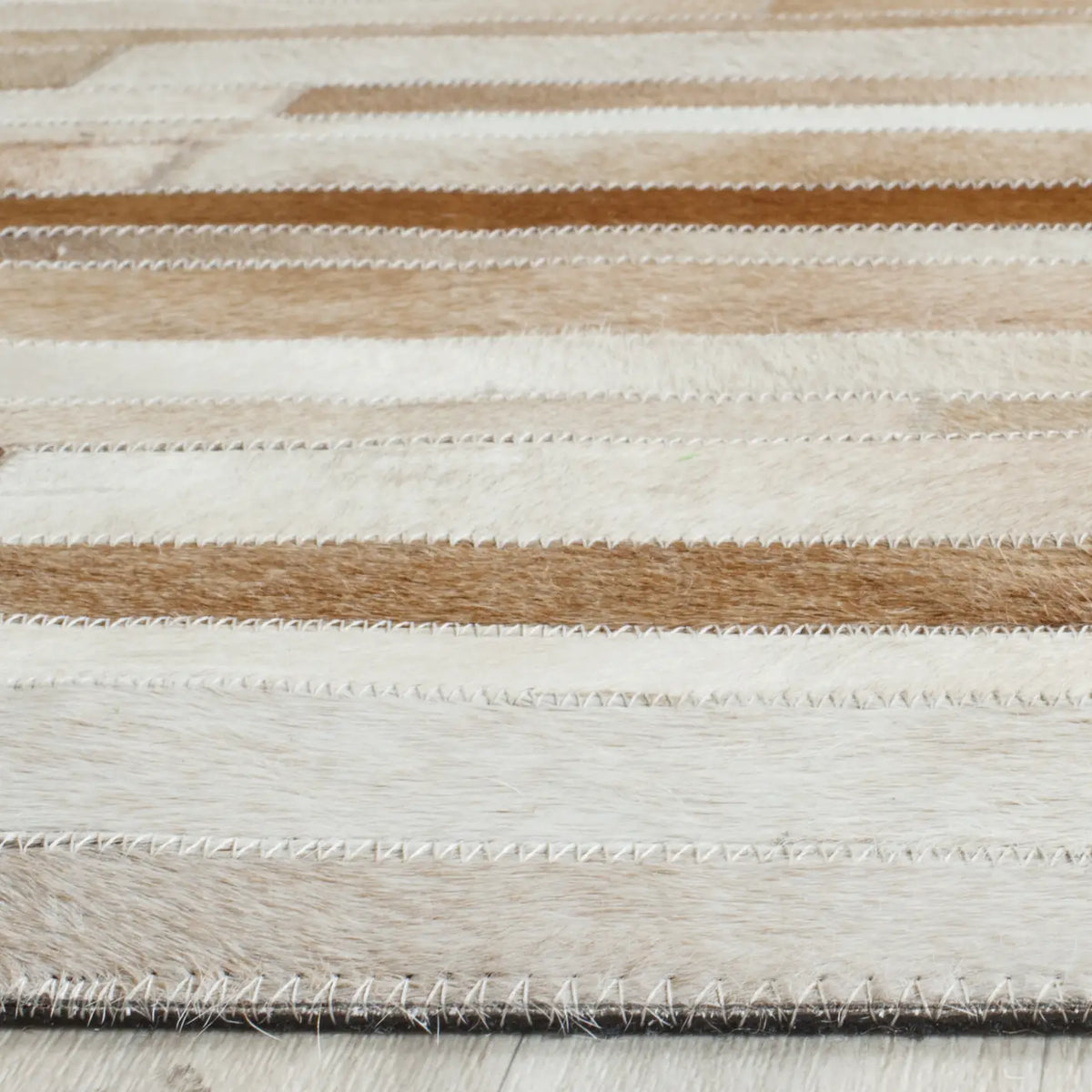 Safavieh Studio Leather 8'-0" x 10'-0" Rug in Tan / Ivory