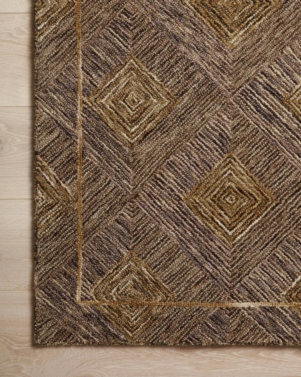 Loloi Varena Var-04 Plum/Gold Rug - corner on wood