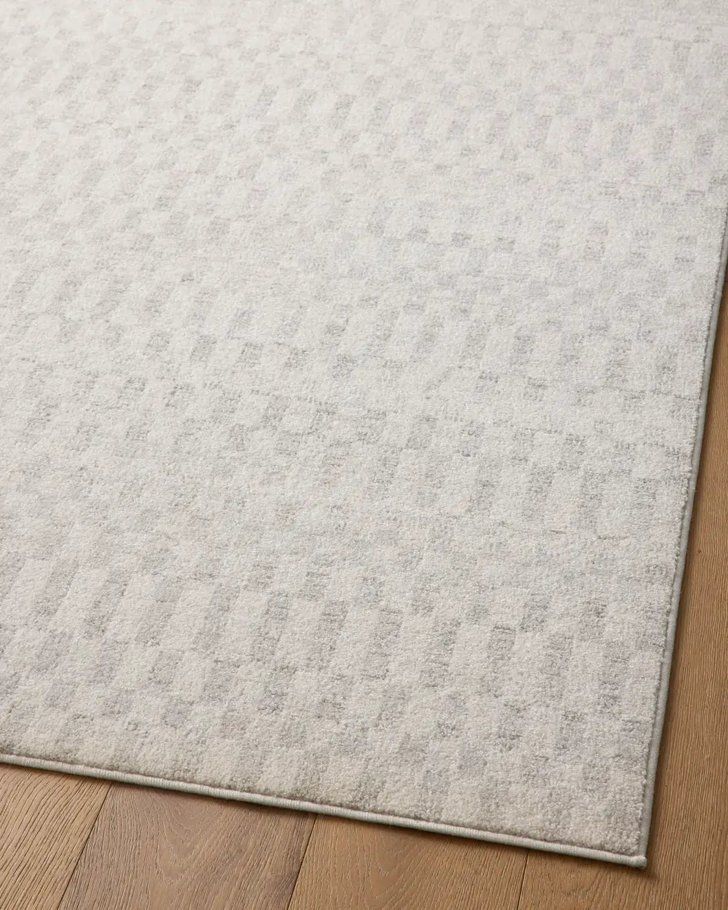 Loloi Kamala Kam-05 Ivory/Grey Rug - angled corner on wood