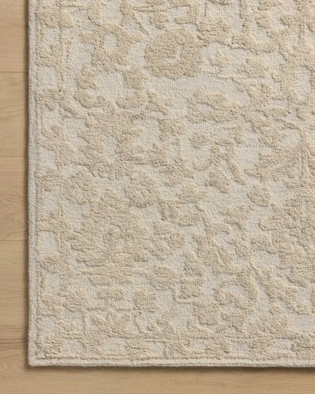 Loloi Prudence PRU-01 Cream / Ivory Hand Tufted Rug - corner on wood