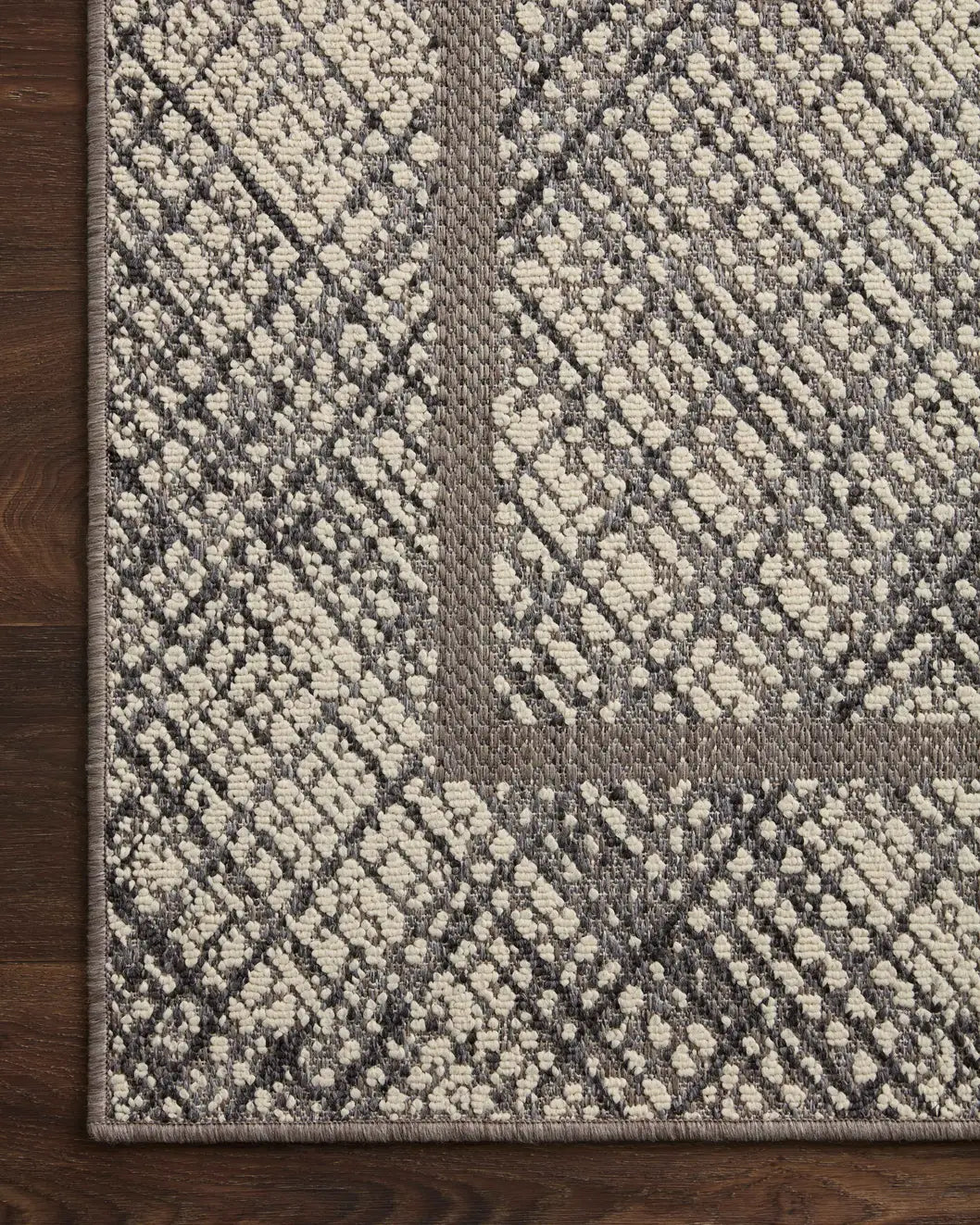 Loloi Rainier Rai-10 Ivory/Charcoal Rug - corner on wood