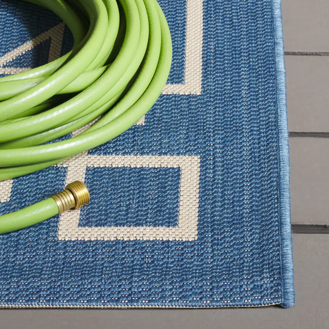 Safavieh Courtyard 5'-3" x 7'-7" Rug in Blue / Light Beige