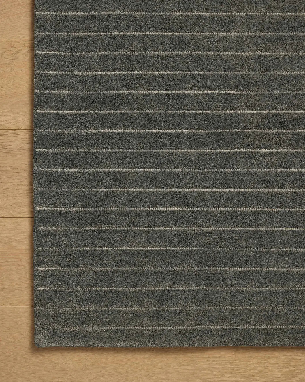 Chris Loves Julia x Loloi Henry HEY-01 Charcoal / Ivory Rug - corner on wood