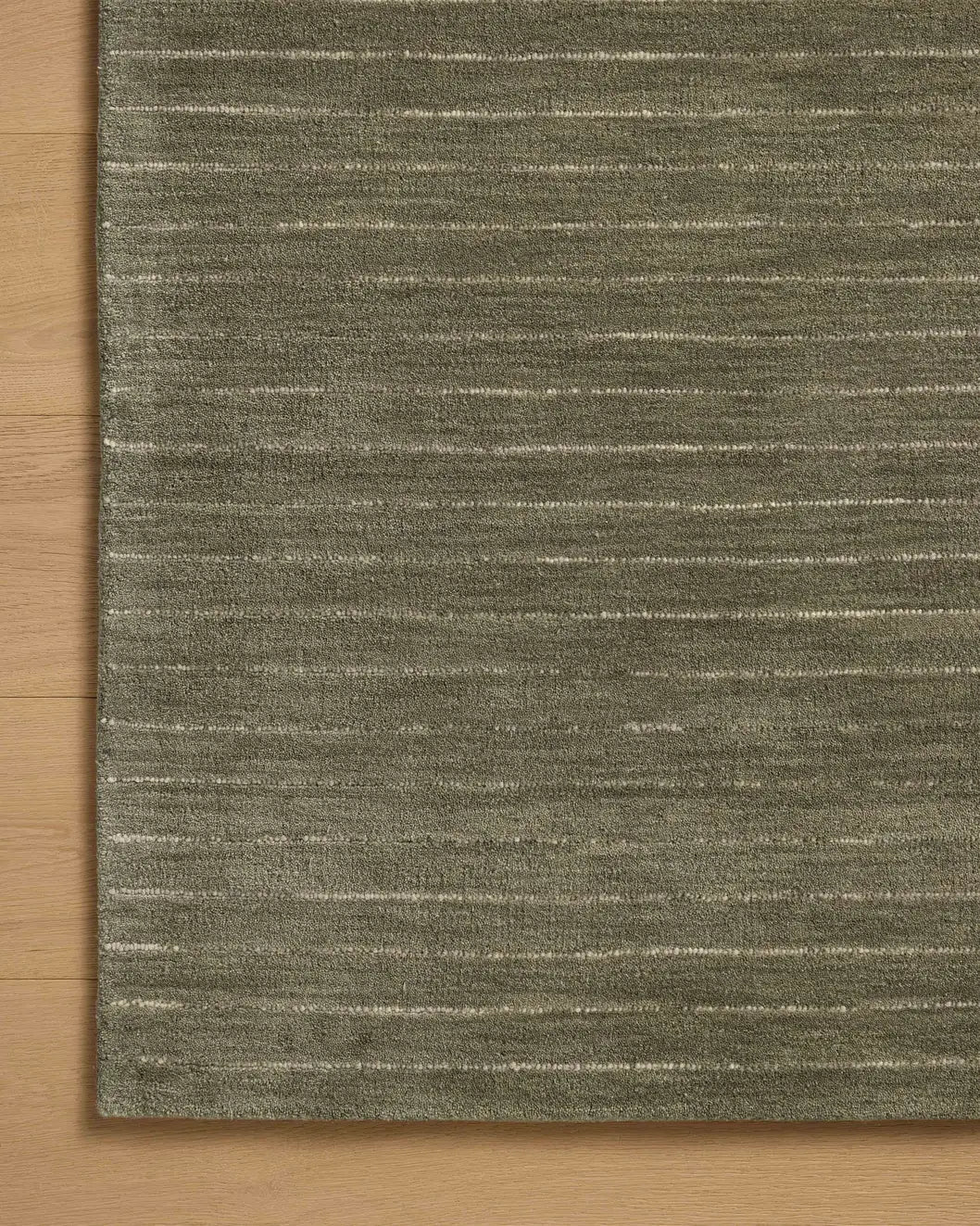Chris Loves Julia x Loloi Henry HEY-01 Olive / Ivory Rug - corner on wood