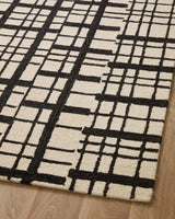 Chris Loves Julia x Loloi Polly POL-02 Black / Ivory Rug - angled corner on wood