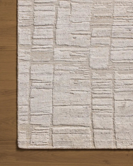 Jean Stoffer x Loloi Daniel DAN-01 Antique Ivory Rug - corner on wood