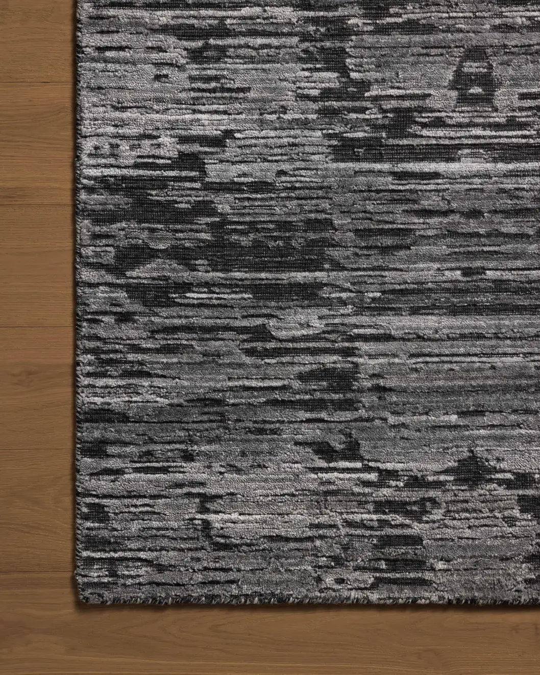 Jean Stoffer x Loloi Daniel DAN-03 Charcoal Rug - corner on wood