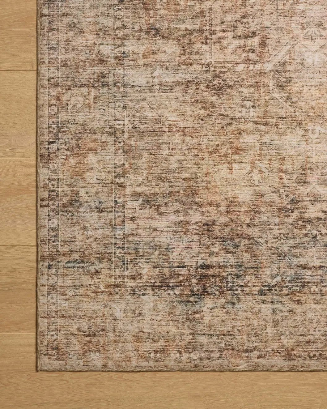 Loloi Anniston ANS-06 Clay / Charcoal Rug - corner on wood