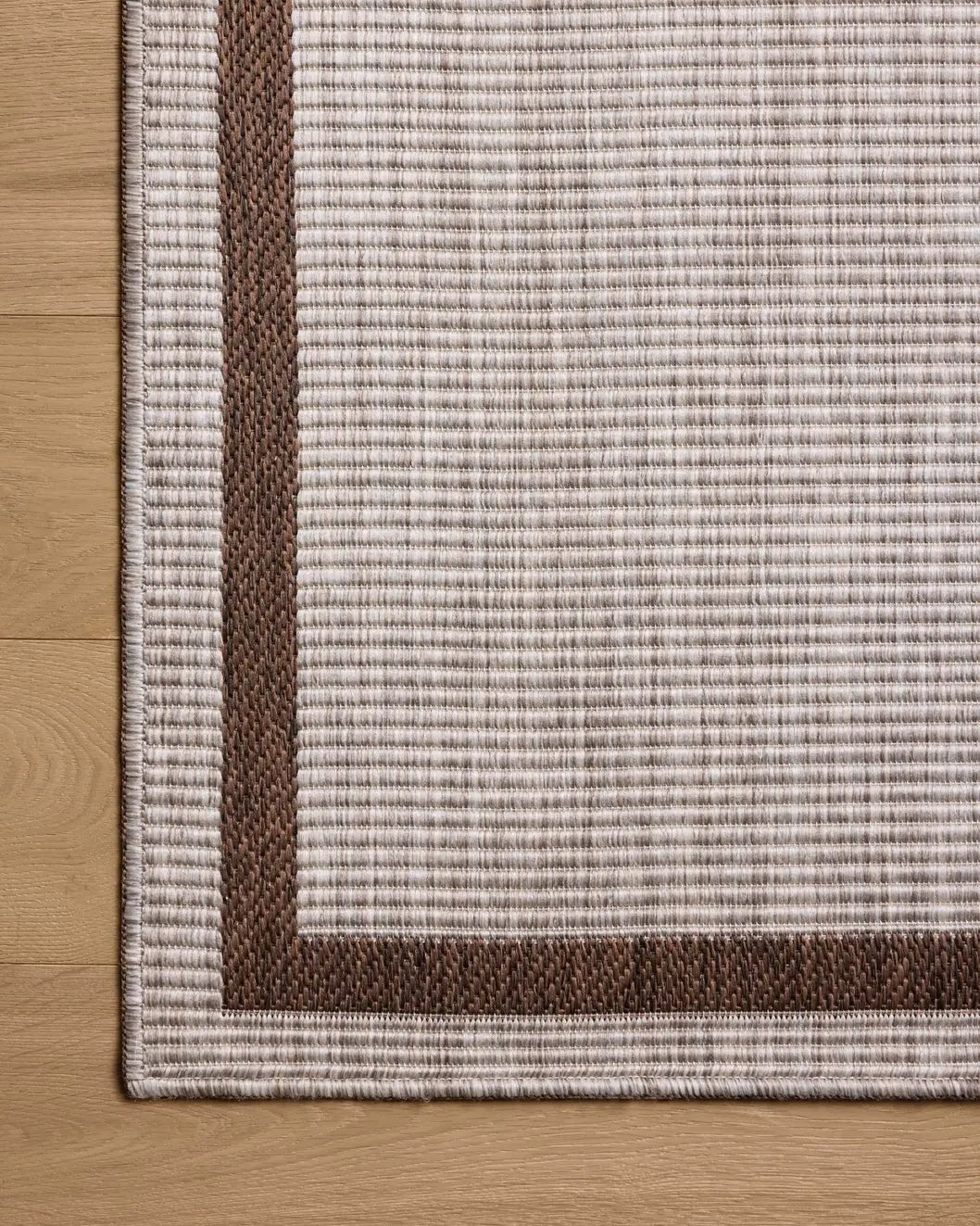Loloi Easton ESN-02 Dove / Coffee Rug - corner on wood