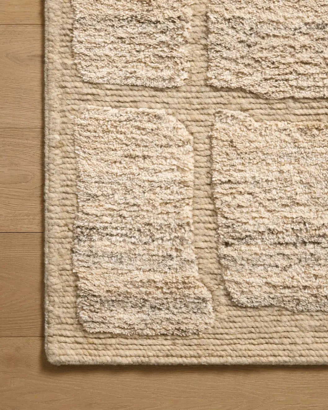 Loloi Hughes HUS-01 Natural Rug - corner on wood