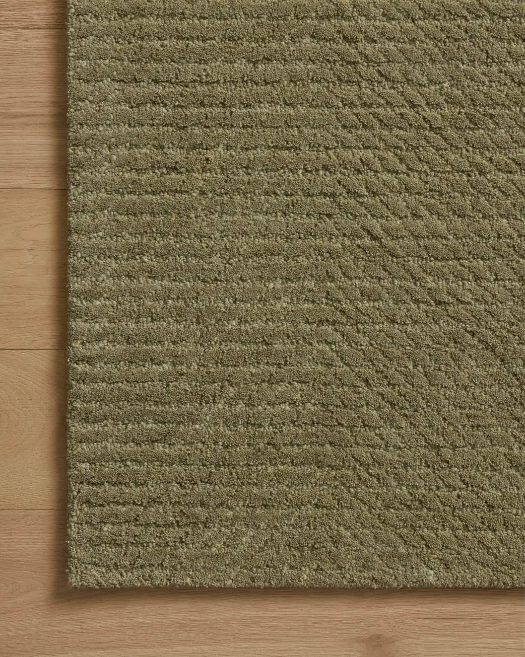 Loloi Kai KAI-01 Olive Rug - corner on wood