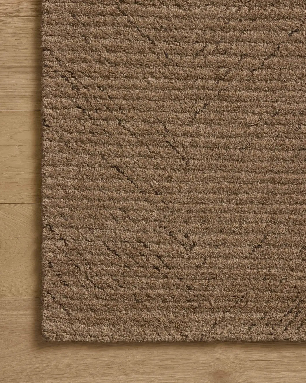 Loloi Kai KAI-01 Pebble Rug - corner on wood