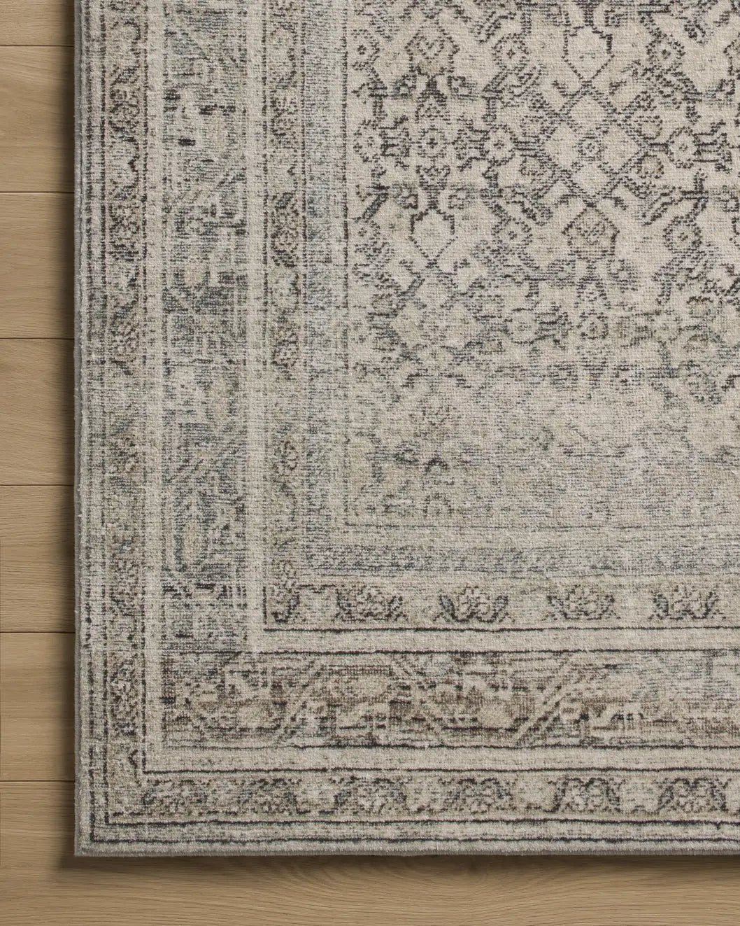 Loloi Margot MAT-08 Ivory / Slate Rug - corner on wood
