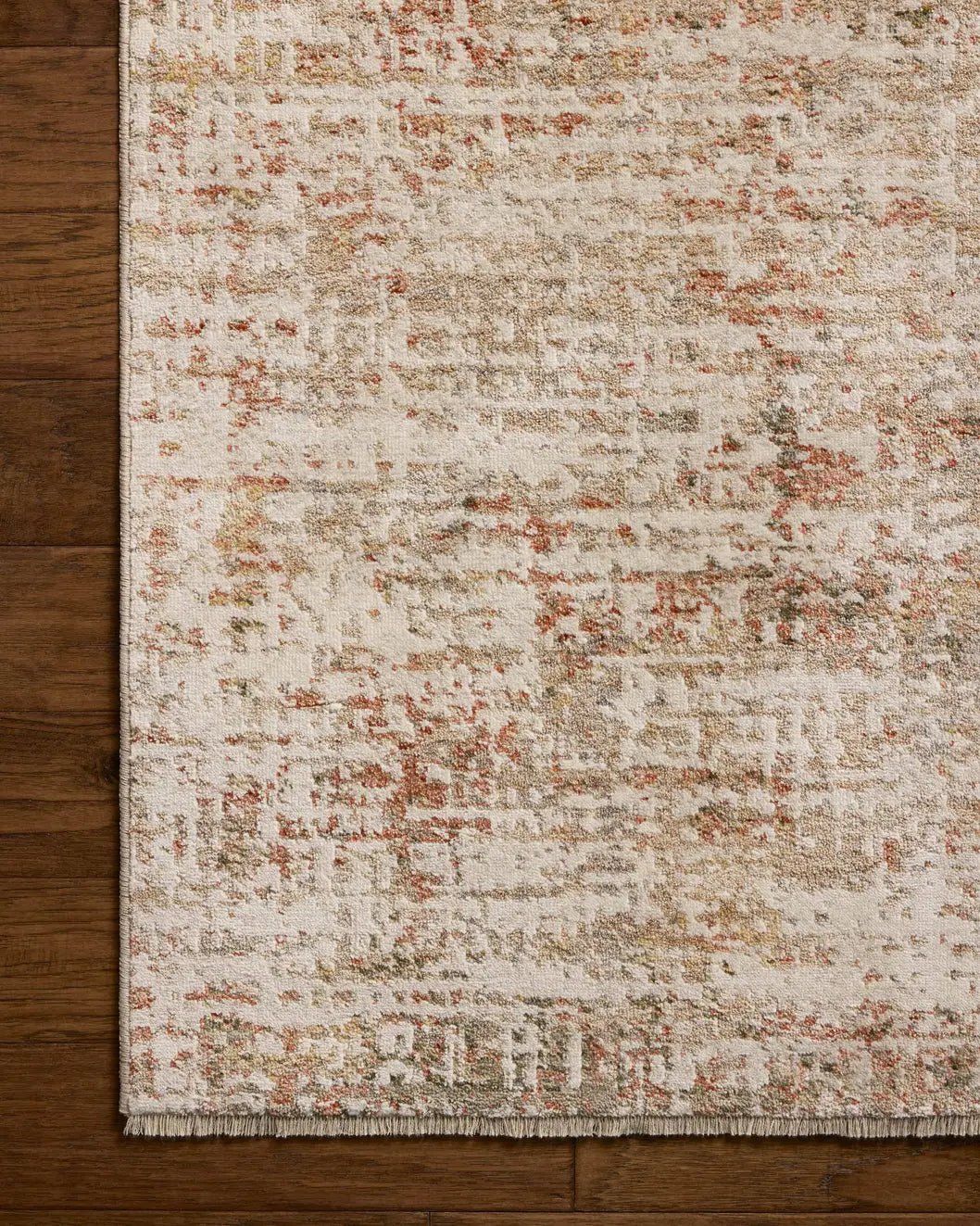 Loloi Nellie NEL-02 Natural / Sunset Rug - corner on wood