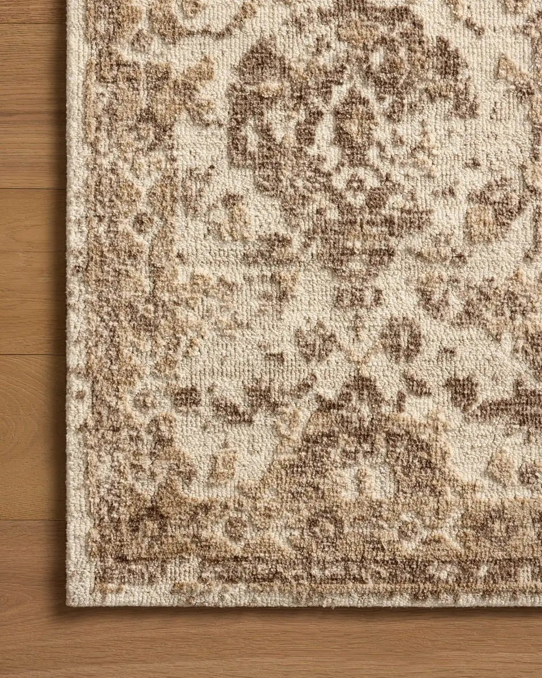 Loloi Percival PCV-01 Ivory / Natural Rug - corner on wood